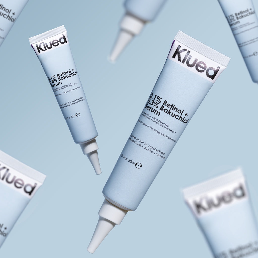 Klued skincare serum bottles on a light blue background