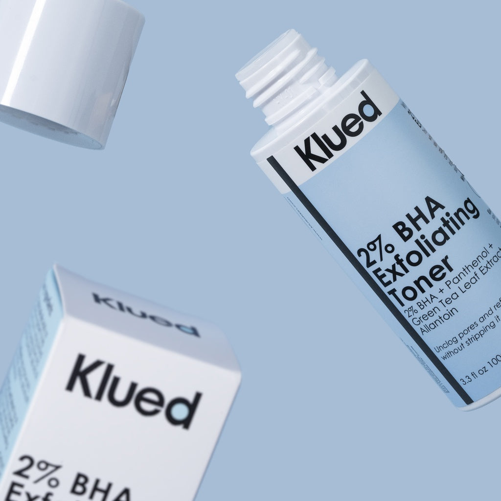 Klued 2% BHA Exfoliating Toner packaging on a light blue background