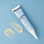 Klued 0.5% Retinol Serum tube with a swatch on a blue background