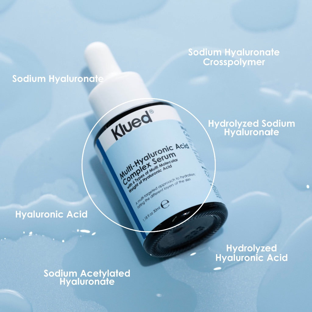 Klued serum bottle with labeled components on a blue background