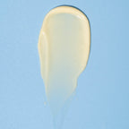 Beige cream sample on a blue background