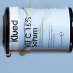 Klued Vit C 15% Serum bottle on a light blue background