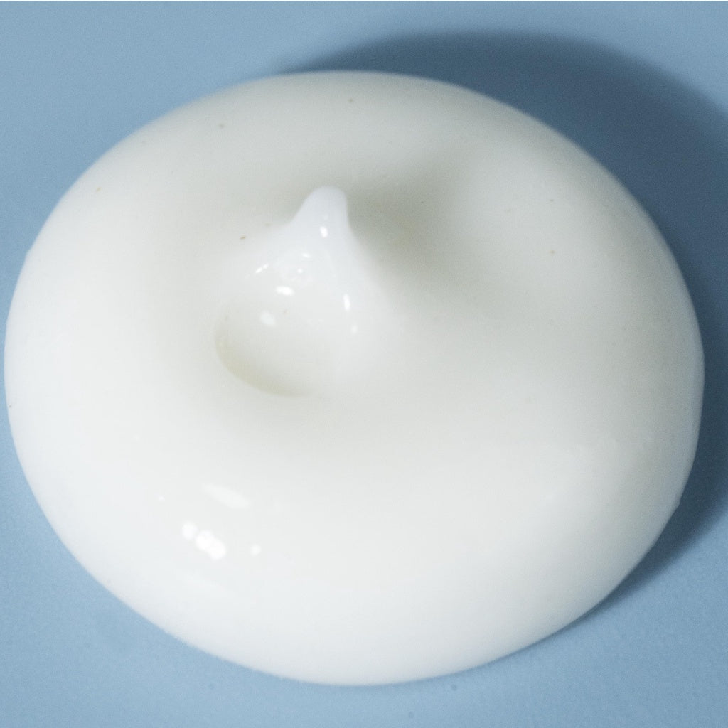 White ceramic object on a blue background